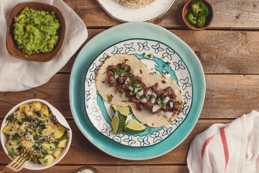 carne asada tacos and assorted toppings